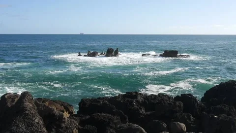 Extreme wave crushing coast breaking over dangerous rocks in Cascais, Portugal Stock Footage 130258106