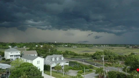 Extreme weather storm front with lightning over homes Stock Footage 192950501