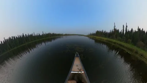 Extreme wide-angle view from the front of a canoe as it is being paddled  Stock Footage 247788963