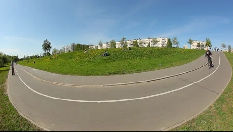 Extreme wide angle view on the road turn in the park. Stock Footage