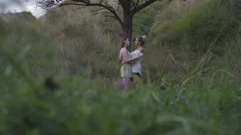 Extreme wide shot of mother and daughter... | Stock Video | Pond5