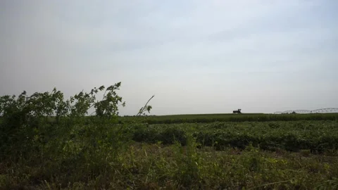 Extreme Wide Slide Down of a Swather Stock Footage 221863173