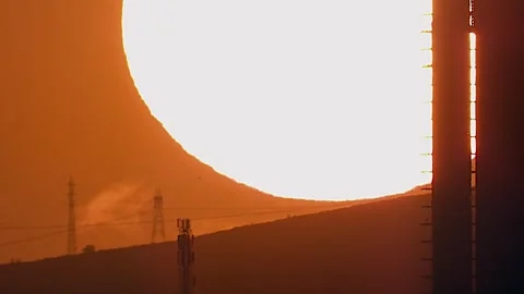 Extreme zoom construction sunrise time - Worksite Silhouette and Urban Building Stock Footage 339727565