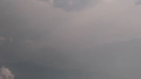 Extremely beautiful clouds and scenic mountains landscape, view from the plane Stock Footage 303377628