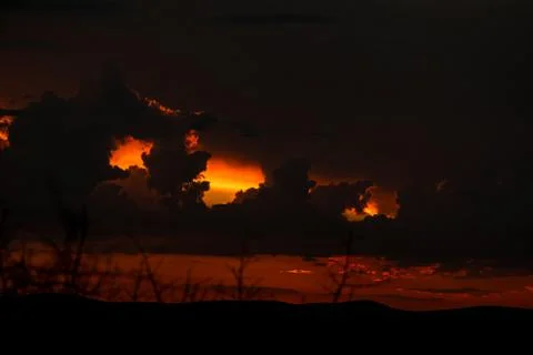 Extremely black sky with sunset. Typical African sky. Namibia. Africa. Stock Photos