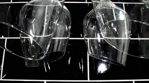 Extremely close-up detailed .Clean stylish wine glasses hanging upside down Stock Footage 194558654