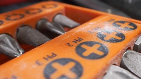 Extremely close-up, detailed. drill bits in orange toolbox Stock Footage 148116677