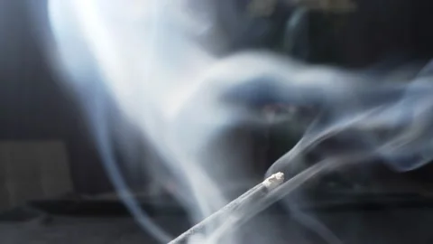 Extremely close-up detailed Incense, incense sticks smoldering with clouds of Stock Footage 194491116
