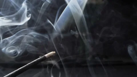 Extremely close-up detailed Incense, incense sticks smoldering with clouds of Stock Footage 194558445