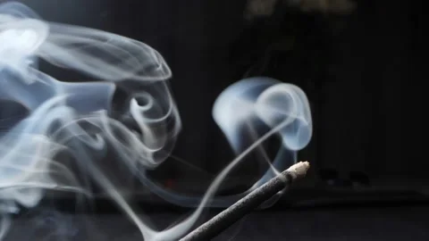 Extremely close-up detailed Incense, incense sticks smoldering with clouds of Stock Footage 194834483