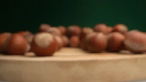 Extremely close-up, detailed. many hazelnuts on a dark background Stock Footage 145281663
