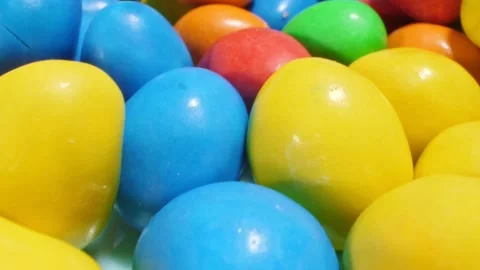 Extremely close-up detailed plan. small colorful oval candies Video stock 195348990