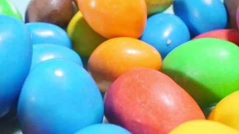 Extremely close-up detailed plan. small colorful oval candies Stock Footage 196160367