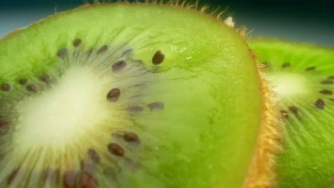 Extremely close-up, detailed. slices of bright juicy green kiwi Stock Footage 146872221