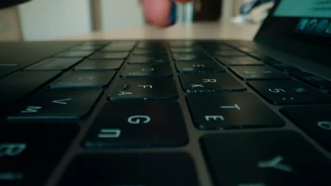 An extremely close-up of human hands typing on a keyboard. Stock-Footage 231645822