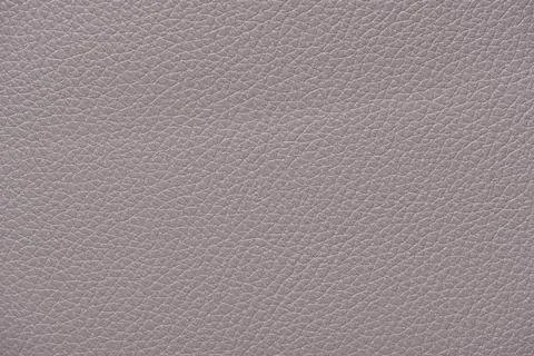 Extremely close-up light grey leather texture background surface Stock Photos