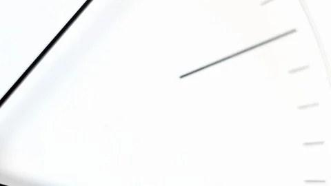 Extremely close up macro footage of a black clock hands on the white dial Stock-Footage 99038342