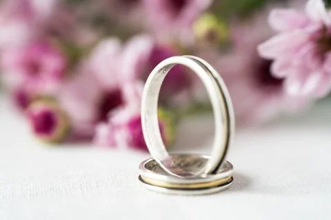 An Extremely close-up of a pair of wedding or engagement rings with an out of Stock Photos