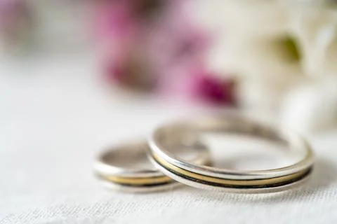 An Extremely close-up of a pair of wedding or engagement rings with an out of Stock Photos