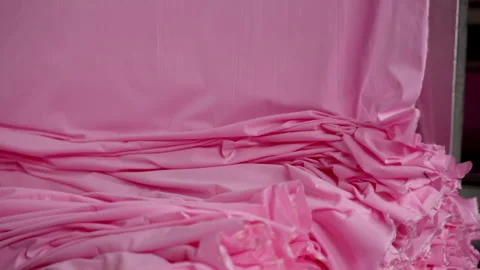 Extremely Close-up of the process of dyeing fabric pink. VietNam Garment Factory Stock Footage 247404769