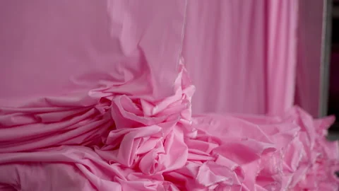 Extremely Close-up of the process of dyeing fabric pink. VietNam Garment Factory Stock Footage 247404770