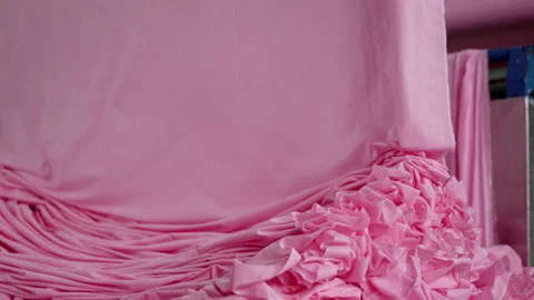 Extremely Close-up of the process of dyeing fabric pink. VietNam Garment Factory Video stock 247404905