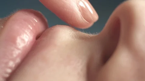 Extremely close-up, shaving a woman's face with a razor, sensitive skin Stock Footage 98202932