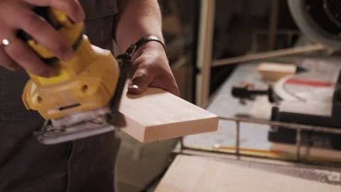 Extremely close shooting of manual grinding process in carpenter's hand. Stock Footage 110676416