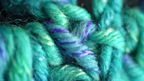 Extremely close-up of the stitches of the knitted product in mother-of-pearl Stock Footage 175708241