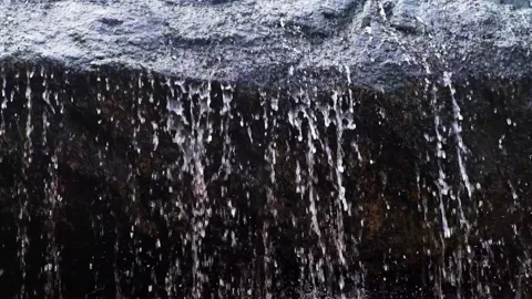 Extremely close up, water droplets falling down in slow-motion Stock Footage 209811940