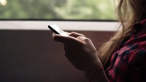 Extremely close up of woman's hands with mobile phone. Casual plaid shirt 스톡 동영상 89956951