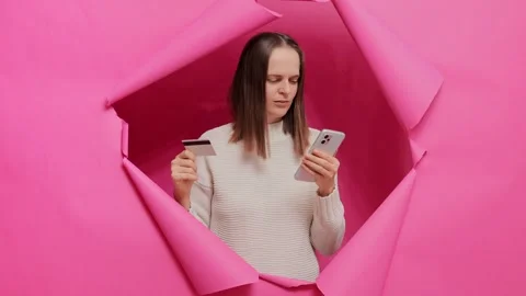 Extremely happy joyful brown haired woman in casual clothing posing in pink Stock Footage 256980485