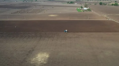 Extremely high altitude perspective showing wide panoramic views of agricultural Stock Footage 337199003