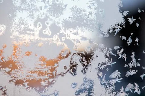 Extremely low temperature. Ice flower on a frozen window Stock Photos