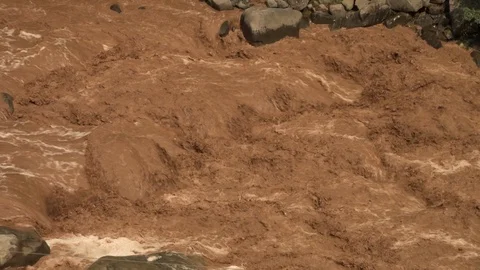 Extremely muddy, fast moving river Stock-Footage 107620146