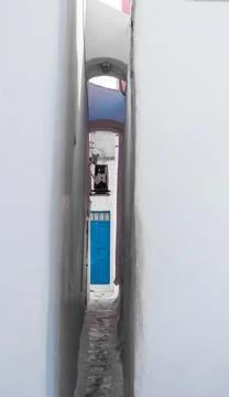 Extremely narrow pass between two buildings Stock Photos