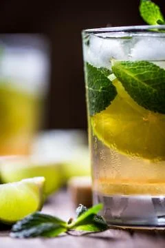 Extremely nice composition of Mojito half glass macro with mint and lime on t Stock Photos