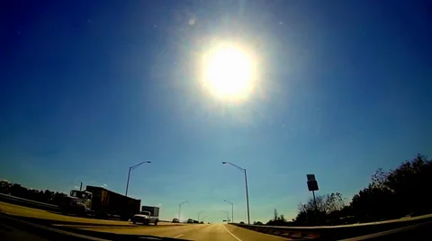 Extremely slow motion traffic under bright noon sun Video stock 35312715