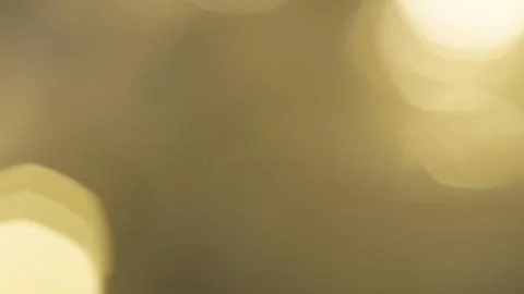 Extremely soft, out of focus golden bokeh light shapes blending smoothly into Stock Photos
