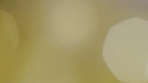 Extremely soft, out of focus golden bokeh light shapes blending smoothly into Stock Photos