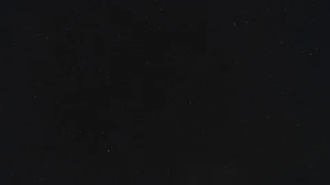 Extremely sparse dust particle system against a black background Stock Footage 113393880