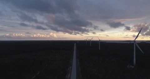 Extremely Straight Road Next to Wind Farm Stock Footage 86402340