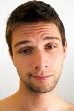 Extremely tired man with half open eyes Foto stock