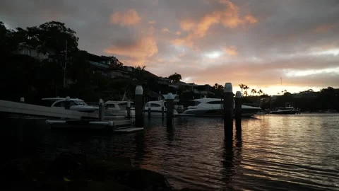 Extremely wealthy Mosman harbour homes and boats at sunset in Sydney 6K Video stock 307974809