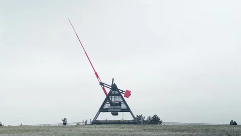 Extremely wide shot of a couple taking auto-portrait by the Metronome in Prague Stock Footage 144910297