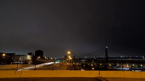 EXTREMELY WIDE TIME-LAPSE OF HIGHWAY AND SKYLINE AT NIGHT Stock Footage 131278136