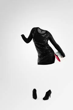 Extrovert meets introvert. Studio shot of an invisible woman dancing against a Stock Photos