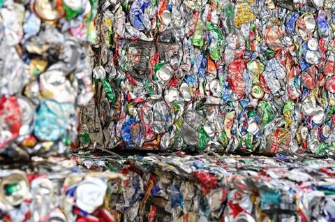 Extruded Aluminum Cans in a Factory for Processing of Secondary Raw Materials. Stock Photos