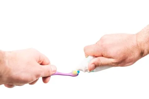 Extrusion of toothpaste on toothbrush Stock Photos