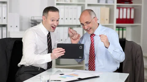 Exultant businessmen find the solution Stock-Footage 26954601